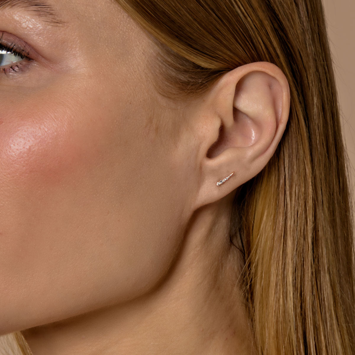 Diamond eyelash stud earrings on model - glamorous eye-catching accessory