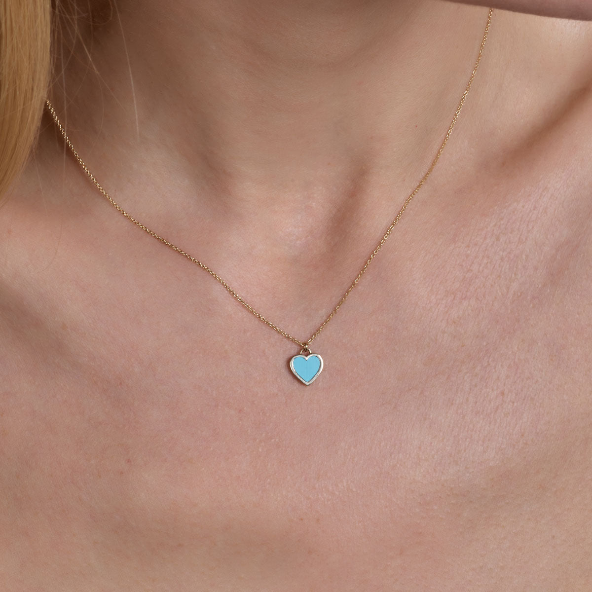 Gold turquoise large heart necklace - bold bohemian pendant adorning model's neck
