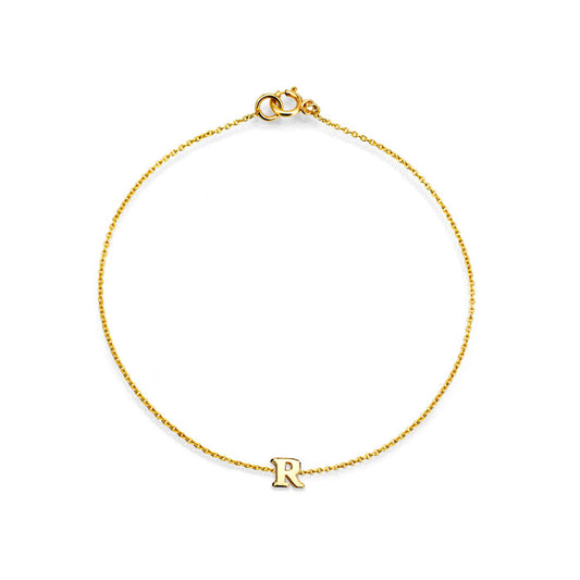 Complete your look with Phoenix Roze's stylish initial letter gold bracelet.